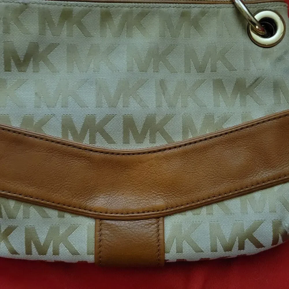 Michael Kors Jamesport Signature Handbag Tab with Leather and Gold Trim Striking